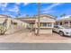 Charming mobile home with carport and well-manicured landscaping, in a desirable neighborhood at 1152 S Sioux Dr, Apache Junction, AZ 85119