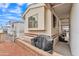 Charming exterior view of the property showcasing the covered porch and well-maintained yard at 1152 S Sioux Dr, Apache Junction, AZ 85119