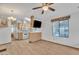 Bright kitchen with wooden cabinets, modern appliances, and a breakfast bar overlooking the dining area at 1152 S Sioux Dr, Apache Junction, AZ 85119