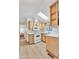 Bright kitchen with wood cabinets, white countertops, and a skylight at 1152 S Sioux Dr, Apache Junction, AZ 85119