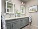 Bathroom with dual vanity, decorative mirrors, and decorative tile accent wall at 11919 N 138Th St, Scottsdale, AZ 85259