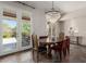 Dining room featuring stone floors, and French doors leading to a balcony at 11919 N 138Th St, Scottsdale, AZ 85259