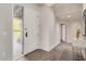 Bright foyer featuring stone floors, a white front door, and an elegant table at 11919 N 138Th St, Scottsdale, AZ 85259