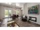 Living room with stone floors, fireplace, and view of patio at 11919 N 138Th St, Scottsdale, AZ 85259