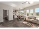 Cozy living room with stone floors, neutral tones, and bright windows at 11919 N 138Th St, Scottsdale, AZ 85259