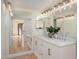 Stylish bathroom with dual sink vanity, modern lighting, and large mirrors at 12222 N Paradise Village S Pkwy # 337, Phoenix, AZ 85032