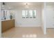 Bright dining area featuring hardwood floors, plantation shutters, and modern lighting fixtures at 12222 N Paradise Village S Pkwy # 337, Phoenix, AZ 85032