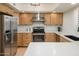 Updated kitchen featuring stainless steel appliances, light wood cabinets, and stylish countertop at 12222 N Paradise Village S Pkwy # 337, Phoenix, AZ 85032