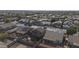 An aerial view captures a neighborhood, highlighting various homes, lush greenery, and a tranquil community atmosphere at 12926 W Pershing St, El Mirage, AZ 85335