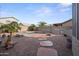 Lush backyard featuring a freeform pool, desert landscaping and a serene atmosphere at 12926 W Pershing St, El Mirage, AZ 85335