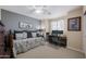 Cozy bedroom featuring a ceiling fan and work space, perfect for relaxation and productivity at 12926 W Pershing St, El Mirage, AZ 85335