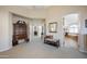 Hallway with seating and a glimpse of the main bathroom at 12926 W Pershing St, El Mirage, AZ 85335