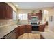 Modern kitchen with stainless steel appliances and ample counter space at 12926 W Pershing St, El Mirage, AZ 85335