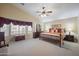 Spacious main bedroom with high ceilings, nice furniture and plenty of light at 12926 W Pershing St, El Mirage, AZ 85335