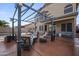 Inviting outdoor patio with comfortable seating under a decorative pergola, creating an ideal space for relaxation and entertainment at 12926 W Pershing St, El Mirage, AZ 85335