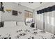 Bedroom featuring a vanity with lighting and a black and white curtain at 12947 W Mauna Loa Ln, El Mirage, AZ 85335