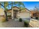 Charming single-story home with desert landscaping, covered entry and two-car garage at 12947 W Mauna Loa Ln, El Mirage, AZ 85335