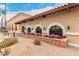 Exterior of the community aquatic center featuring tile roofing and colorful flowers at 13110 W Blue Bonnet Dr, Sun City West, AZ 85375