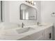 Bathroom featuring dual sinks, modern vanity, and stylish finishes at 13110 W Blue Bonnet Dr, Sun City West, AZ 85375