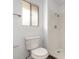 Clean bathroom featuring a shower, toilet and window for natural light at 13110 W Blue Bonnet Dr, Sun City West, AZ 85375