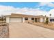 Charming single story home featuring a 2-car garage, desert landscaping, and a welcoming covered entry at 13110 W Blue Bonnet Dr, Sun City West, AZ 85375