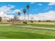 Picturesque golf course showcasing lush greens, mature trees, and clear skies at 13110 W Blue Bonnet Dr, Sun City West, AZ 85375