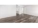 Hallway space featuring hard flooring with view into the updated bathroom at 13110 W Blue Bonnet Dr, Sun City West, AZ 85375