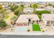 A high angle view of a home featuring a paver driveway and a desert landscaped yard at 15146 W Highland Ave, Goodyear, AZ 85395