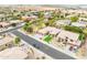 An aerial view of a home in a desert landscaped neighborhood at 15146 W Highland Ave, Goodyear, AZ 85395