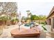 Outdoor kitchen and inground pool in a backyard oasis, perfect for entertaining at 15146 W Highland Ave, Goodyear, AZ 85395