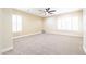 Bright, spacious bedroom with neutral carpet, plantation shutters, and ample natural light at 15146 W Highland Ave, Goodyear, AZ 85395