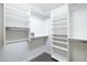 Well-organized walk-in closet featuring white shelving and ample storage space at 15146 W Highland Ave, Goodyear, AZ 85395