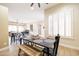 Bright dining area features modern furnishings, a decorative centerpiece, and shuttered windows at 15146 W Highland Ave, Goodyear, AZ 85395