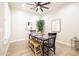 Cozy dining area with modern table and chairs, complemented by a rustic bench and natural light at 15146 W Highland Ave, Goodyear, AZ 85395