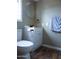 Cozy bathroom with a toilet, vanity, round mirror, and laminate flooring at 15625 N 25Th St # 21, Phoenix, AZ 85032