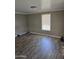 Bedroom boasts wood-look flooring and a bright window letting in plenty of natural light at 15625 N 25Th St # 21, Phoenix, AZ 85032