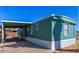 Exterior view of a manufactured home, with a convenient carport for covered parking at 15625 N 25Th St # 21, Phoenix, AZ 85032