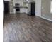 Bright kitchen features white cabinets, stainless steel appliances, and wood-look flooring at 15625 N 25Th St # 21, Phoenix, AZ 85032