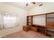 Bedroom featuring a large window seat and natural light with view of the pool at 15644 S 13Th Pl, Phoenix, AZ 85048