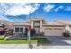 Charming single-Gathering home featuring a well-maintained lawn, two-car garage and desert landscaping at 15644 S 13Th Pl, Phoenix, AZ 85048