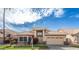 Charming single-story home with a well-manicured lawn, desert landscaping, and a two-car garage at 15644 S 13Th Pl, Phoenix, AZ 85048