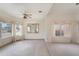 Spacious formal living area with neutral carpet, large bright windows, and decorative mirror at 15644 S 13Th Pl, Phoenix, AZ 85048