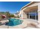 Inviting backyard pool with a sunny patio for relaxing and entertaining with desert landscaping at 15644 S 13Th Pl, Phoenix, AZ 85048