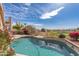 Sparkling pool with beautiful views of the community golf course and bright blue skies at 15644 S 13Th Pl, Phoenix, AZ 85048