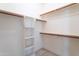 Walk-in closet with built-in shelving and plenty of storage space at 15644 S 13Th Pl, Phoenix, AZ 85048