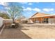 Large backyard featuring a covered patio, another covered structure, and plenty of space at 1619 E Silverbirch Ave, Buckeye, AZ 85326