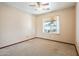 Clean bedroom with neutral walls and carpets, awaiting personalization at 1619 E Silverbirch Ave, Buckeye, AZ 85326