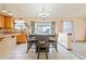 Cozy dining area features a chandelier and a large window offering natural light at 1619 E Silverbirch Ave, Buckeye, AZ 85326