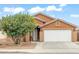 Charming single-story home featuring a two-car garage and mature landscaping at 1619 E Silverbirch Ave, Buckeye, AZ 85326