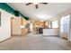 Open-concept living room and kitchen provide ample space for relaxation and socializing at 1619 E Silverbirch Ave, Buckeye, AZ 85326